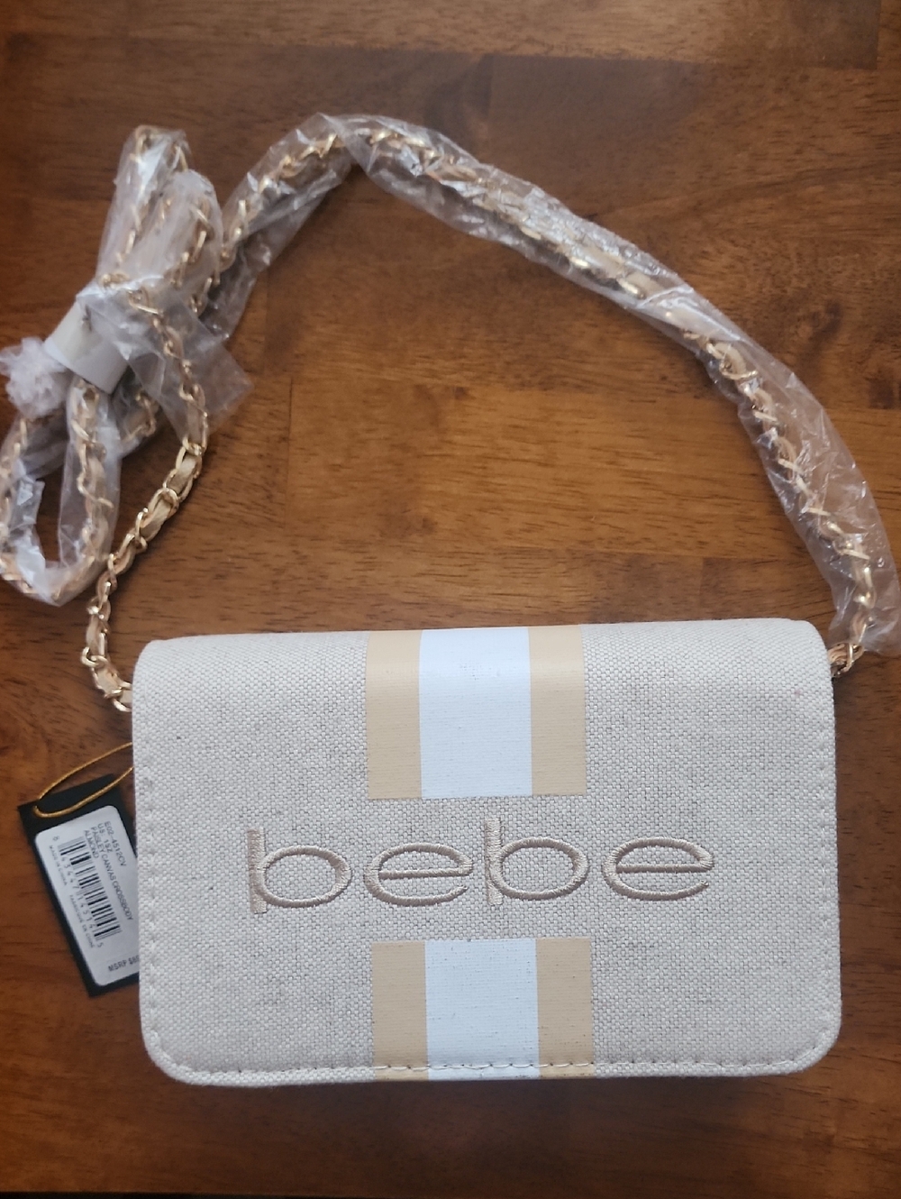 New bebe Cream and Gold Stripe Chain Crossbody. NWT